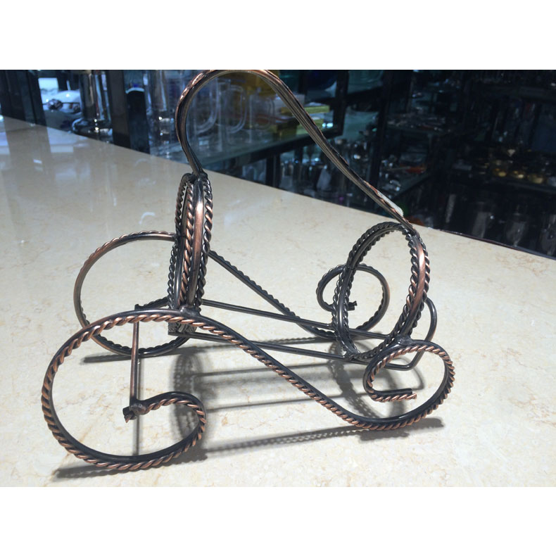 Vintage horse-drawn iron wine rack